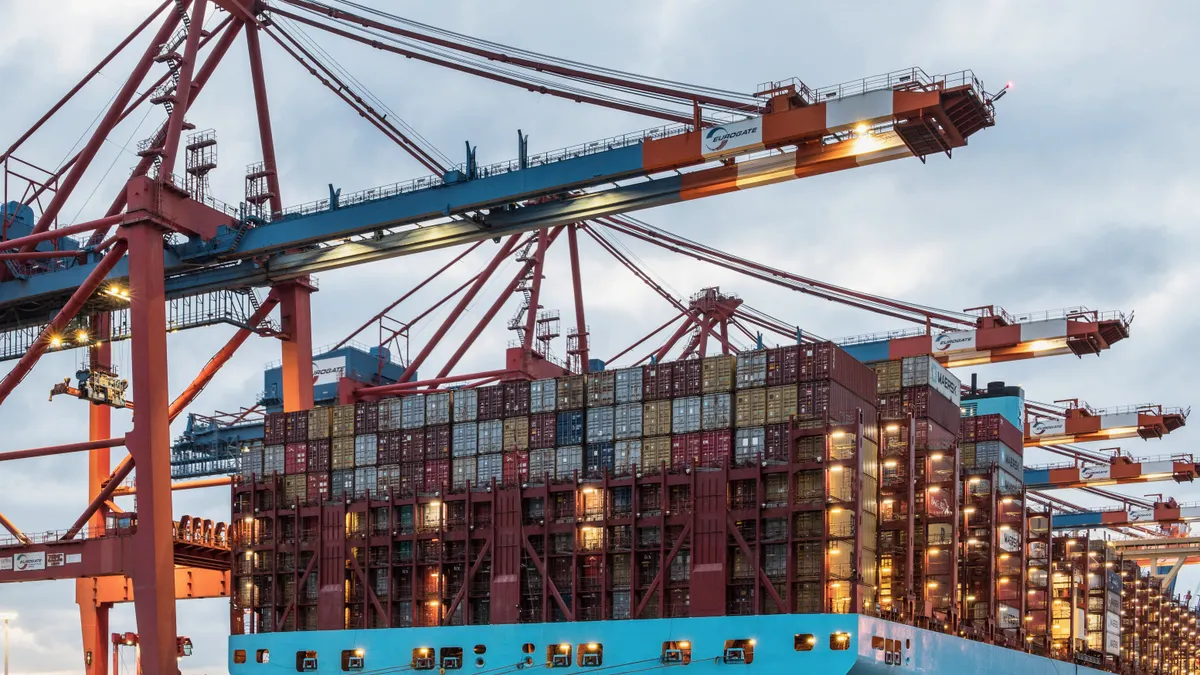 A cargo ship loaded with containers at Hamburg's bustling commercial dock.