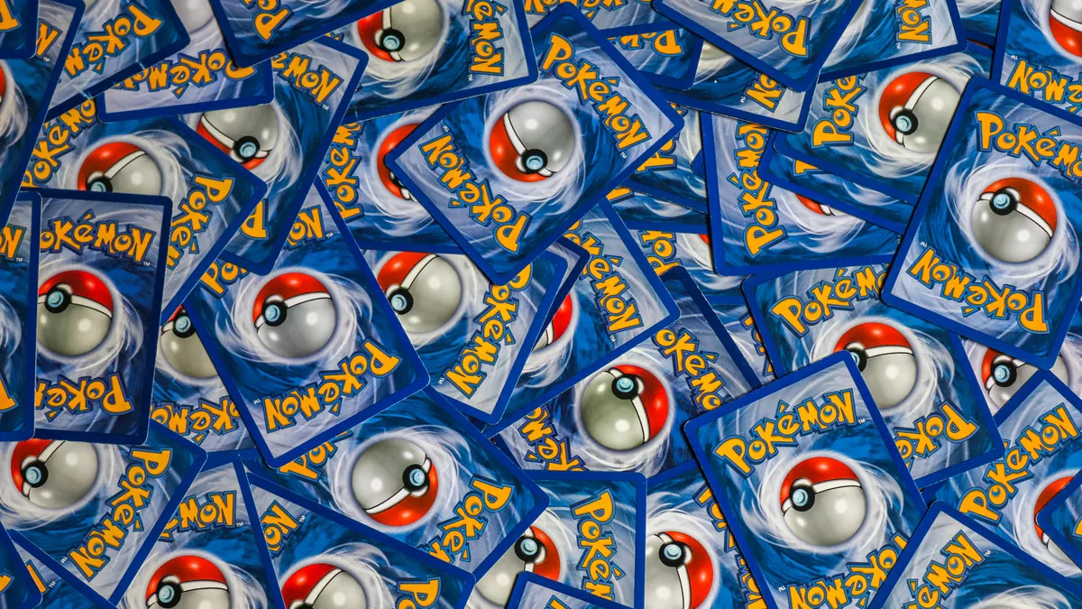 A vibrant collection of Pokemon trading cards featuring iconic Pokeball design and Pokemon logo.