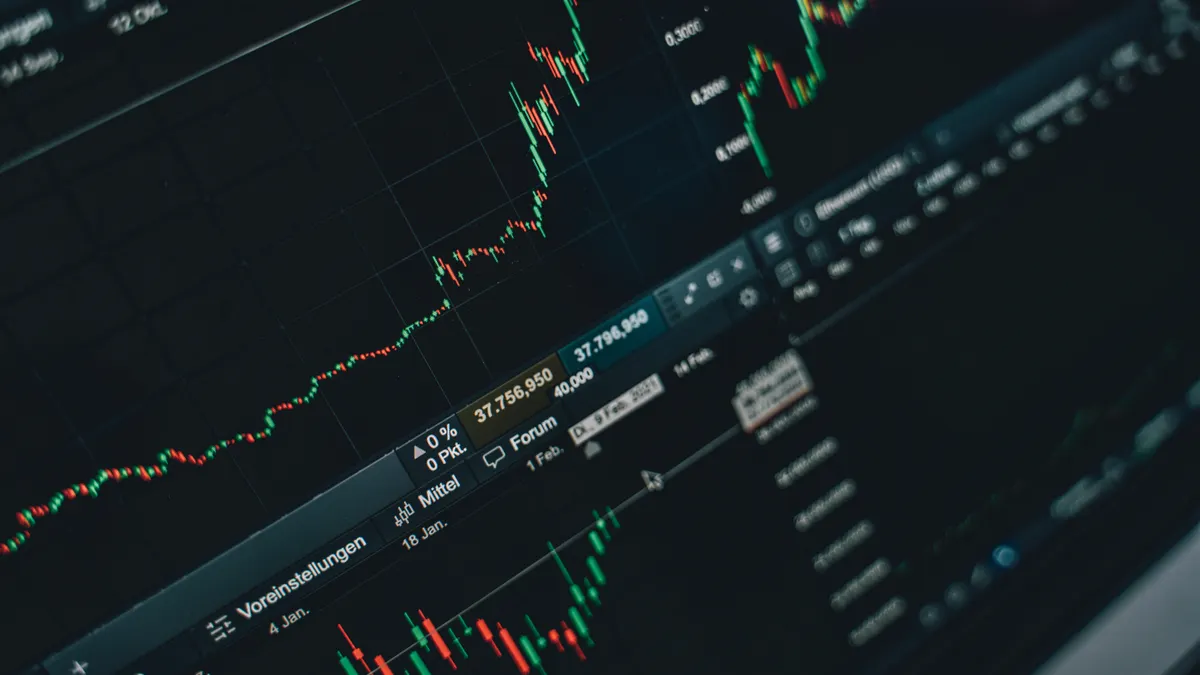 Close-up of stock market trading screen displaying financial growth and charts.